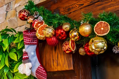 holiday garland and stocking on mantle